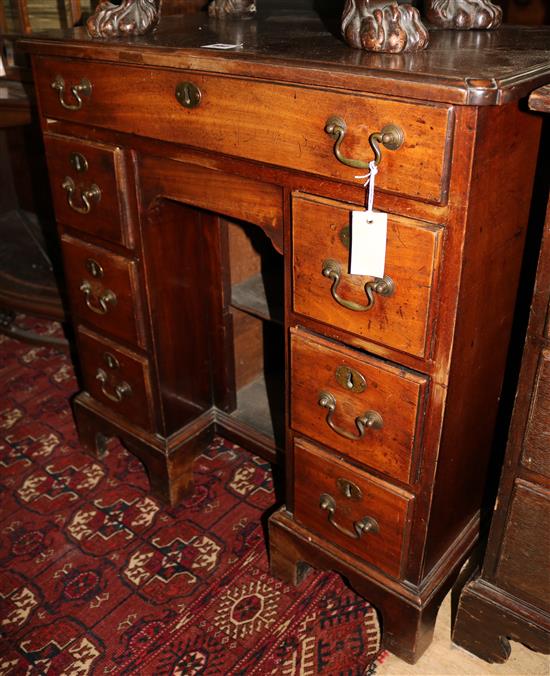 A George III mahogany kneehole desk, W.2ft 6in. D.1ft 8in. H.2ft 7in.